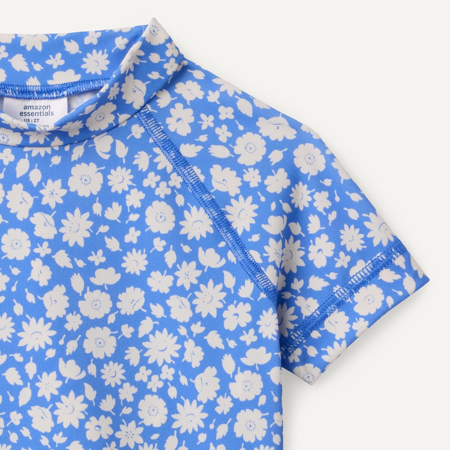 image:imageAmazon Essentials Girls and Toddlers Short Sleeve Slim Fit HighNeck Rashguard TShirtBlue Ditsy Floral