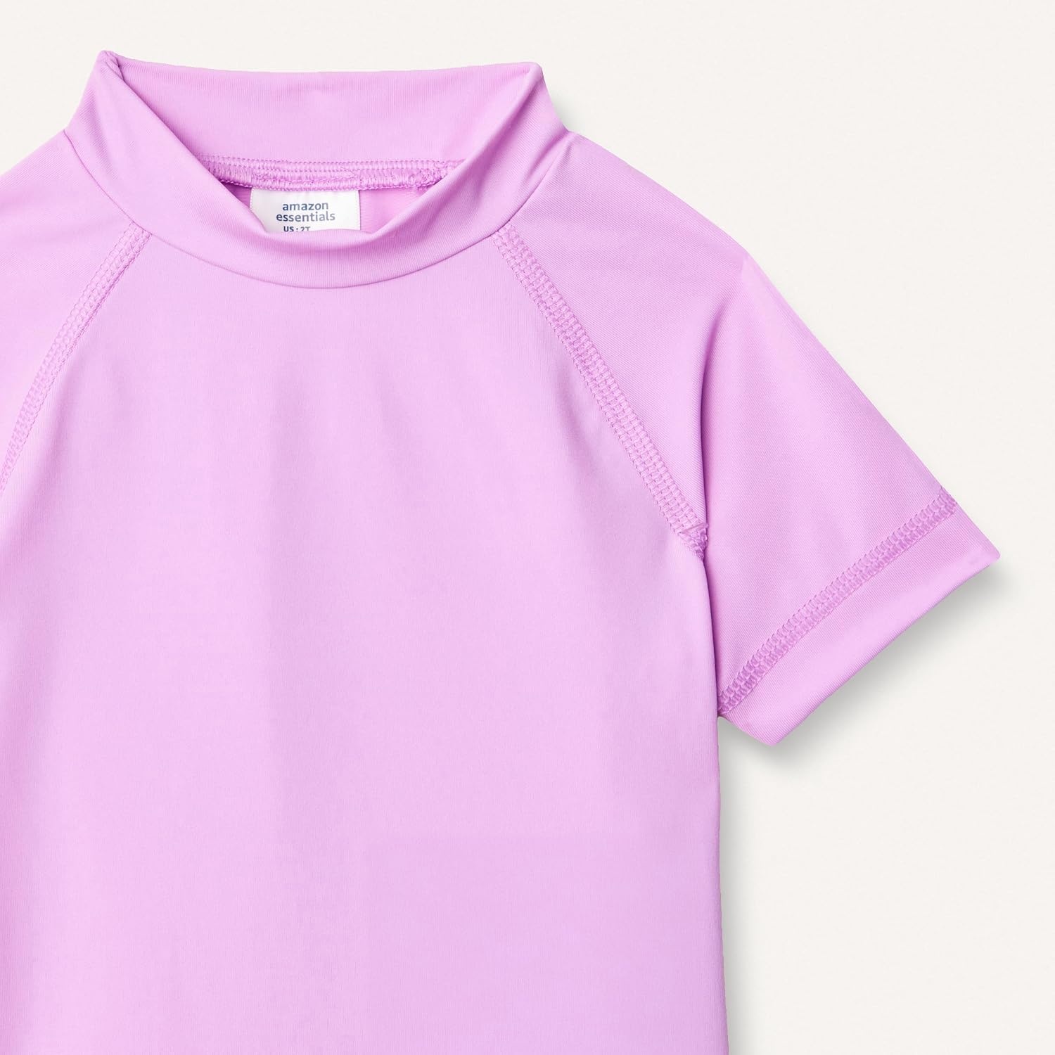 image:imageAmazon Essentials Girls and Toddlers Short Sleeve Slim Fit HighNeck Rashguard TShirtBright Lavender