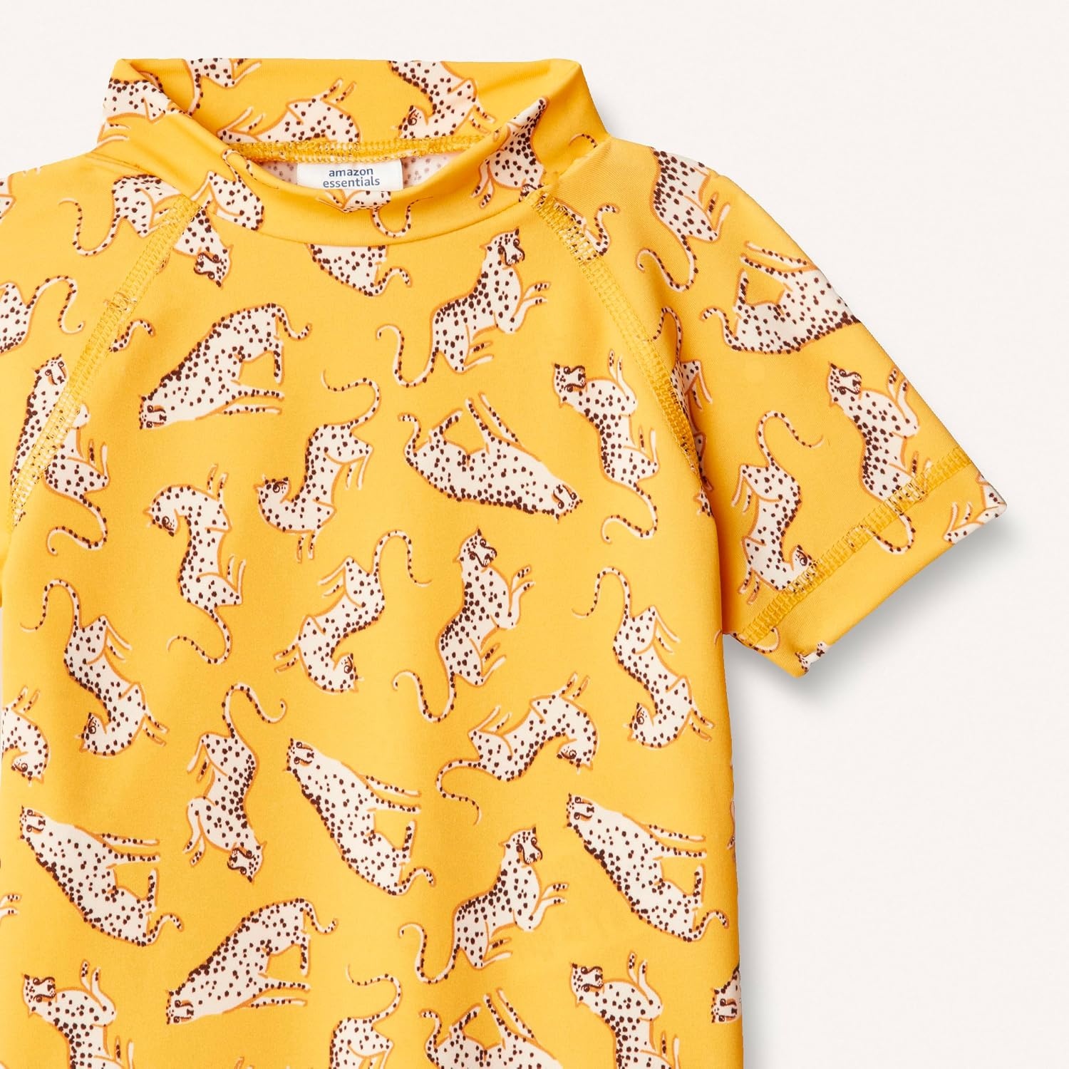image:imageAmazon Essentials Girls and Toddlers Short Sleeve Slim Fit HighNeck Rashguard TShirtGolden Yellow Beige Leopard