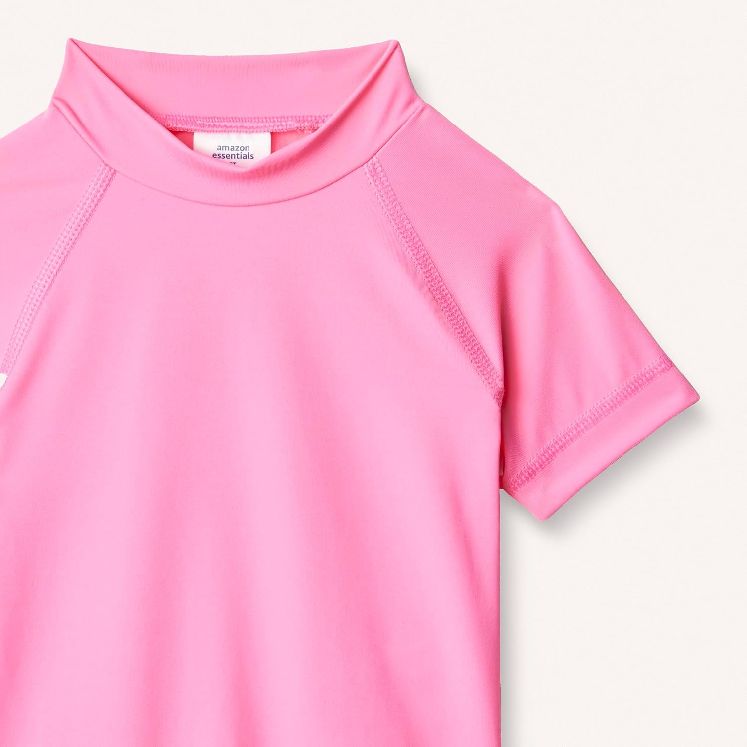 image:imageAmazon Essentials Girls and Toddlers Short Sleeve Slim Fit HighNeck Rashguard TShirtHot Pink