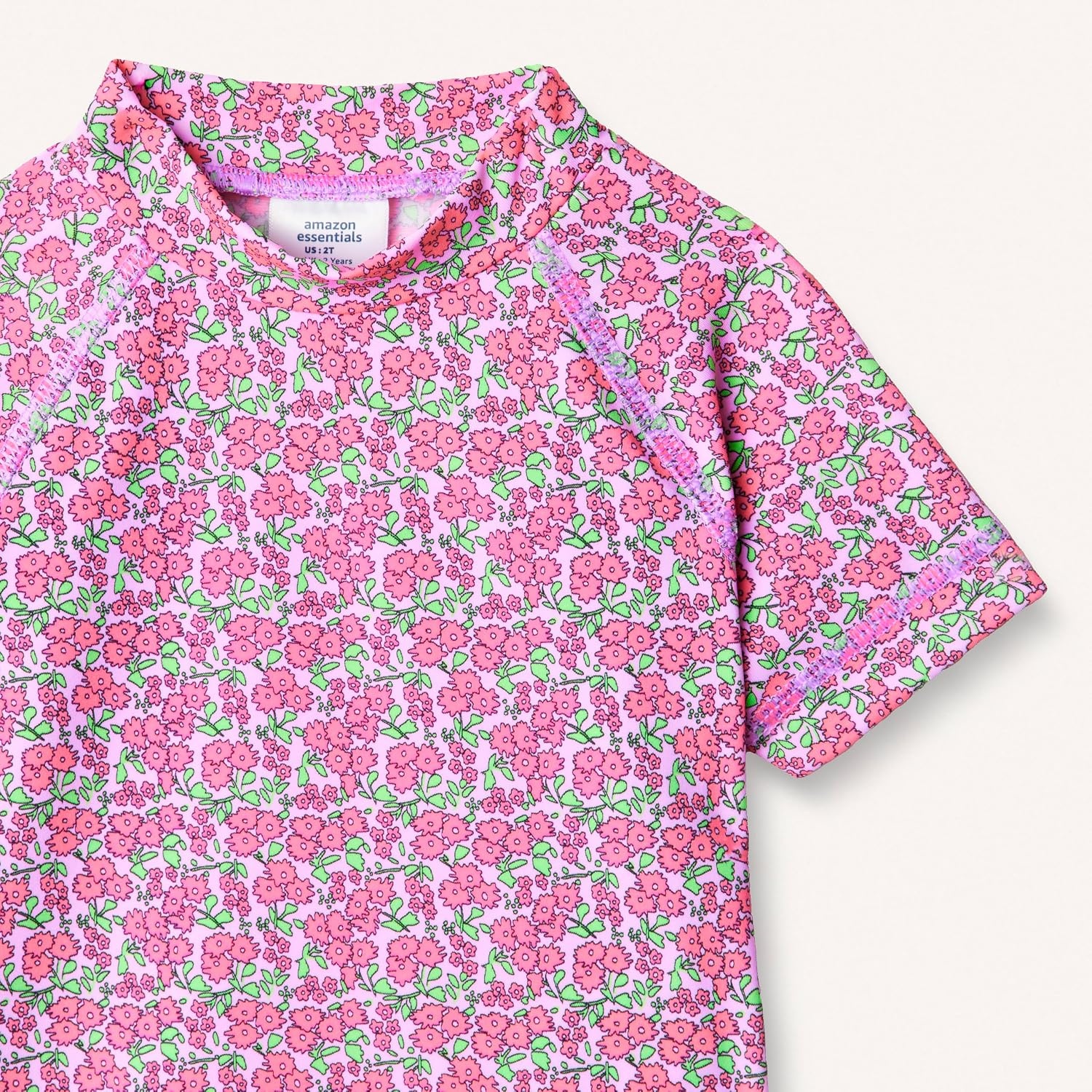 image:imageAmazon Essentials Girls and Toddlers Short Sleeve Slim Fit HighNeck Rashguard TShirtLilac Hot Pink Posey Floral