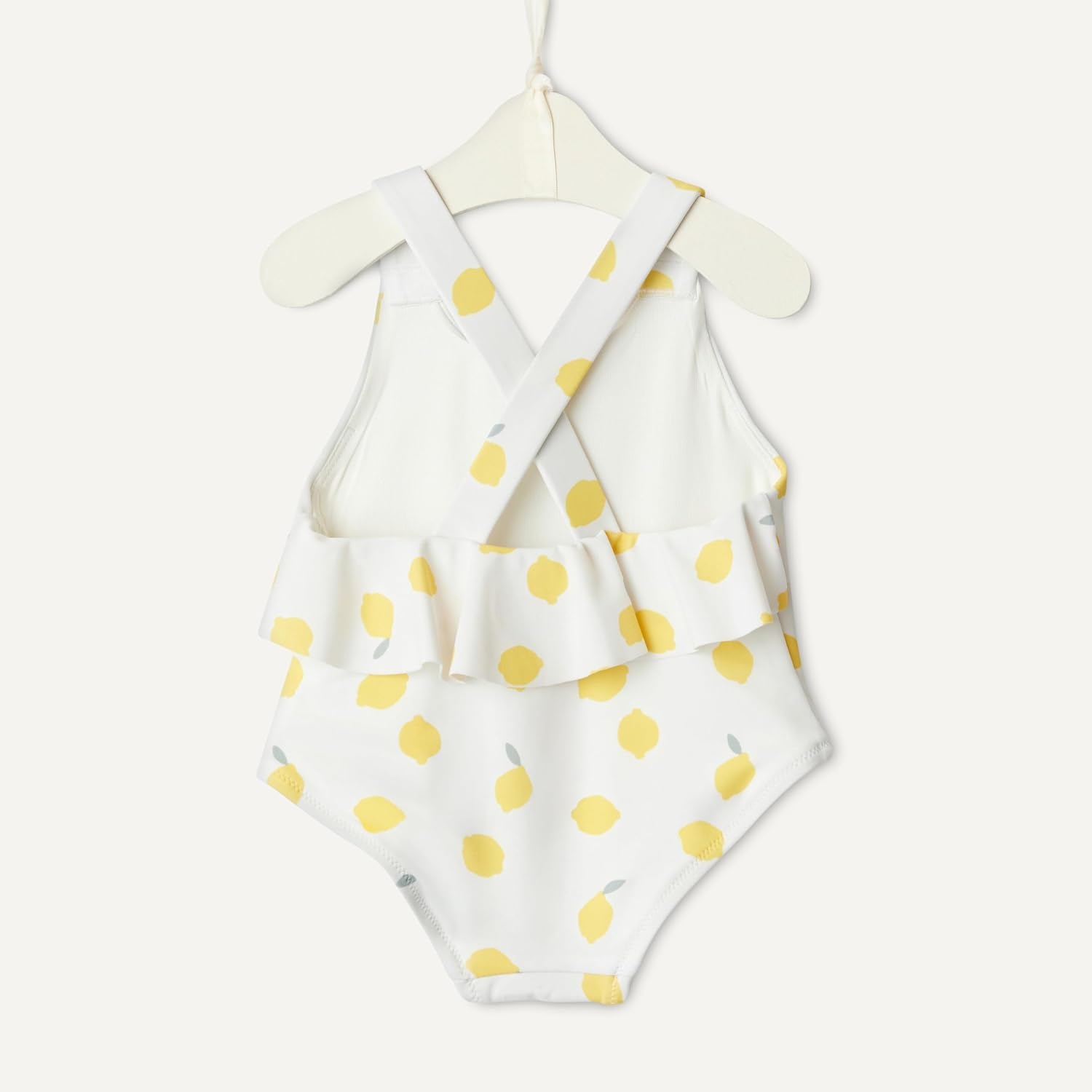 image:imageAmazon Essentials x Sofia Grainge Toddlers and Baby Girls OnePiece Swimsuit with Crisscross Straps Ruffle DetailIvory Lemon