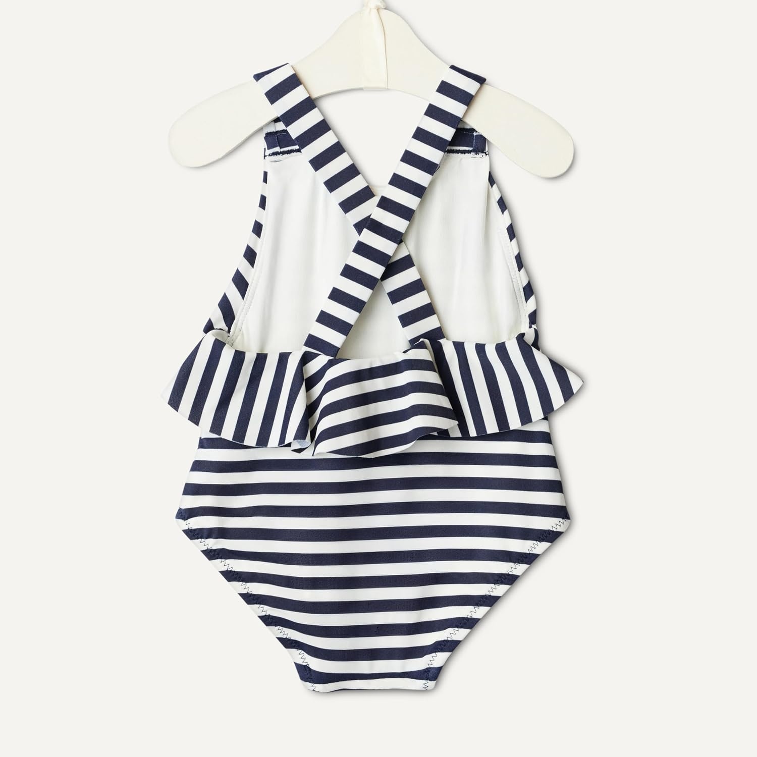 image:imageAmazon Essentials x Sofia Grainge Toddlers and Baby Girls OnePiece Swimsuit with Crisscross Straps Ruffle DetailIvory Navy Even Stripe