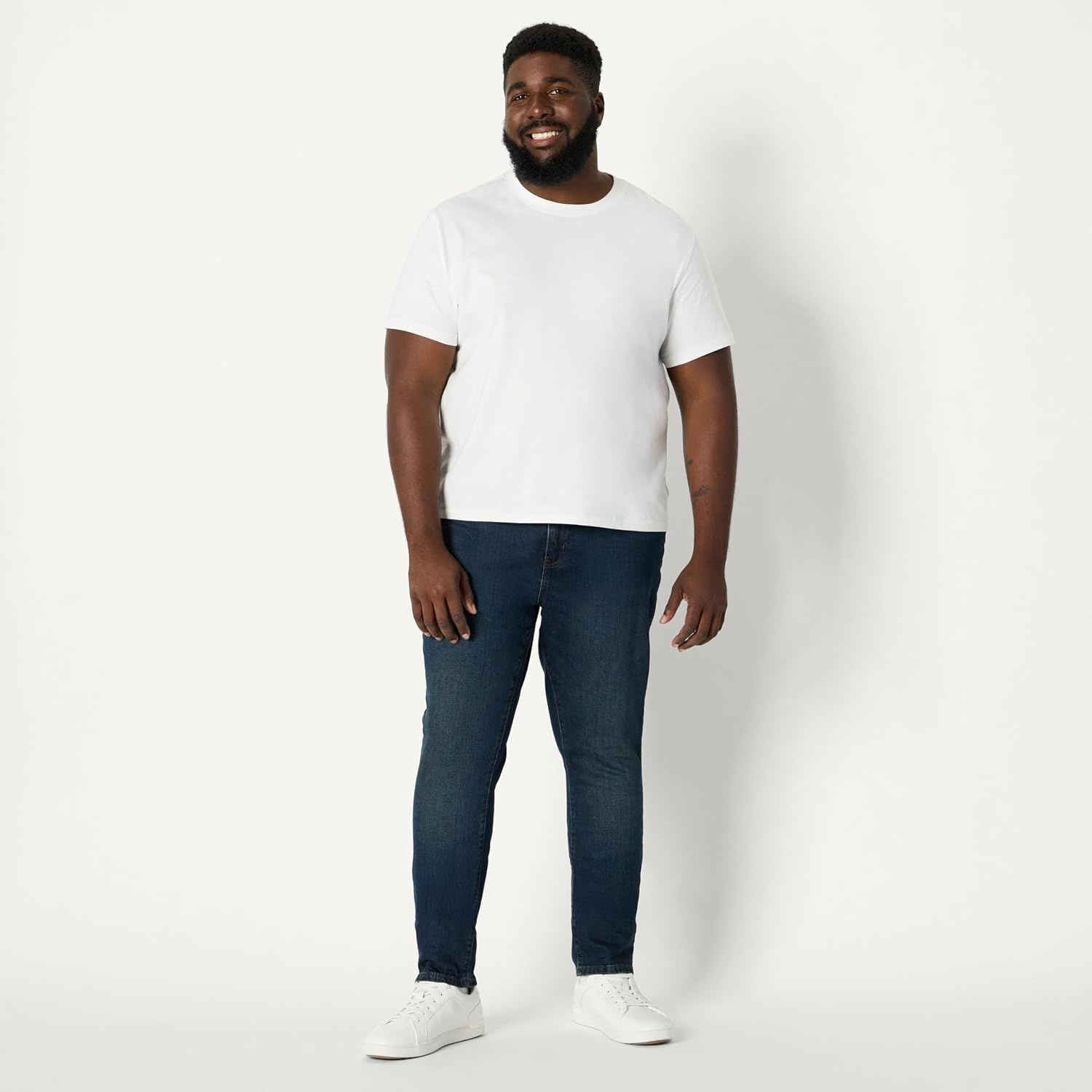 image:imageAmazon Essentials Mens Medium Stretch SkinnyFit JeansTinted Dark Wash