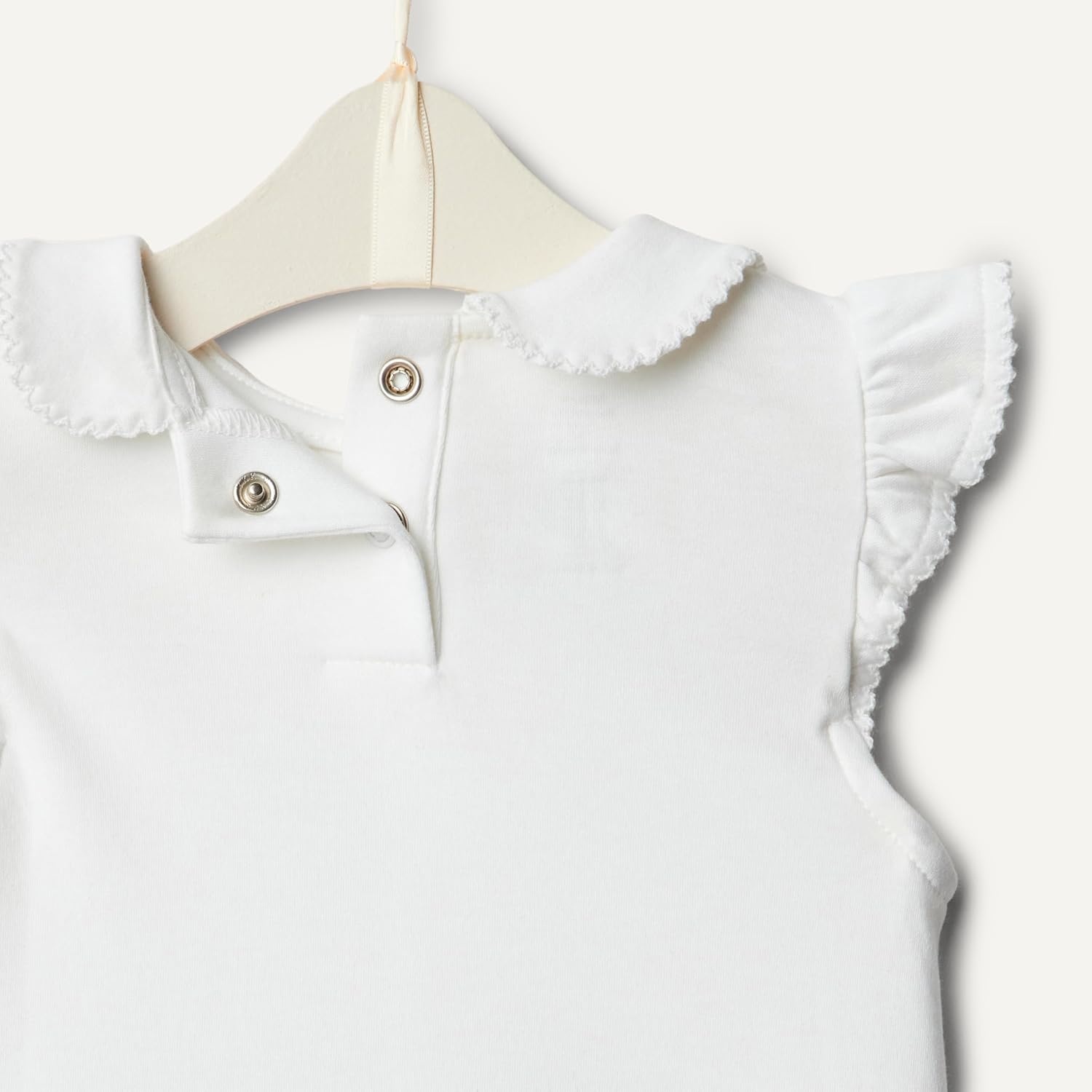 image:imageAmazon Essentials x Sofia Grainge Toddlers and Baby Girls Cotton Short Sleeve Blouses with Ruffles Pack of 2Light PinkWhite