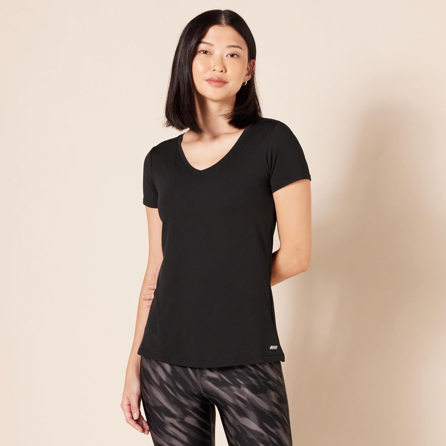 image:imageAmazon Essentials Womens Active Quick Dry Tech Stretch ShortSleeve VNeck TShirt MoistureWicking Pack of 2BlackBright White