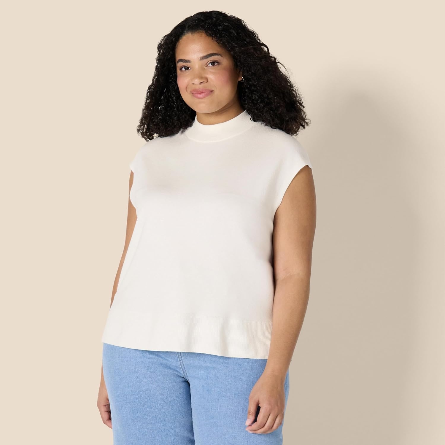image:imageAmazon Essentials Womens RegularFit Cap Sleeve Mock Neck Sweater TopEggshell White