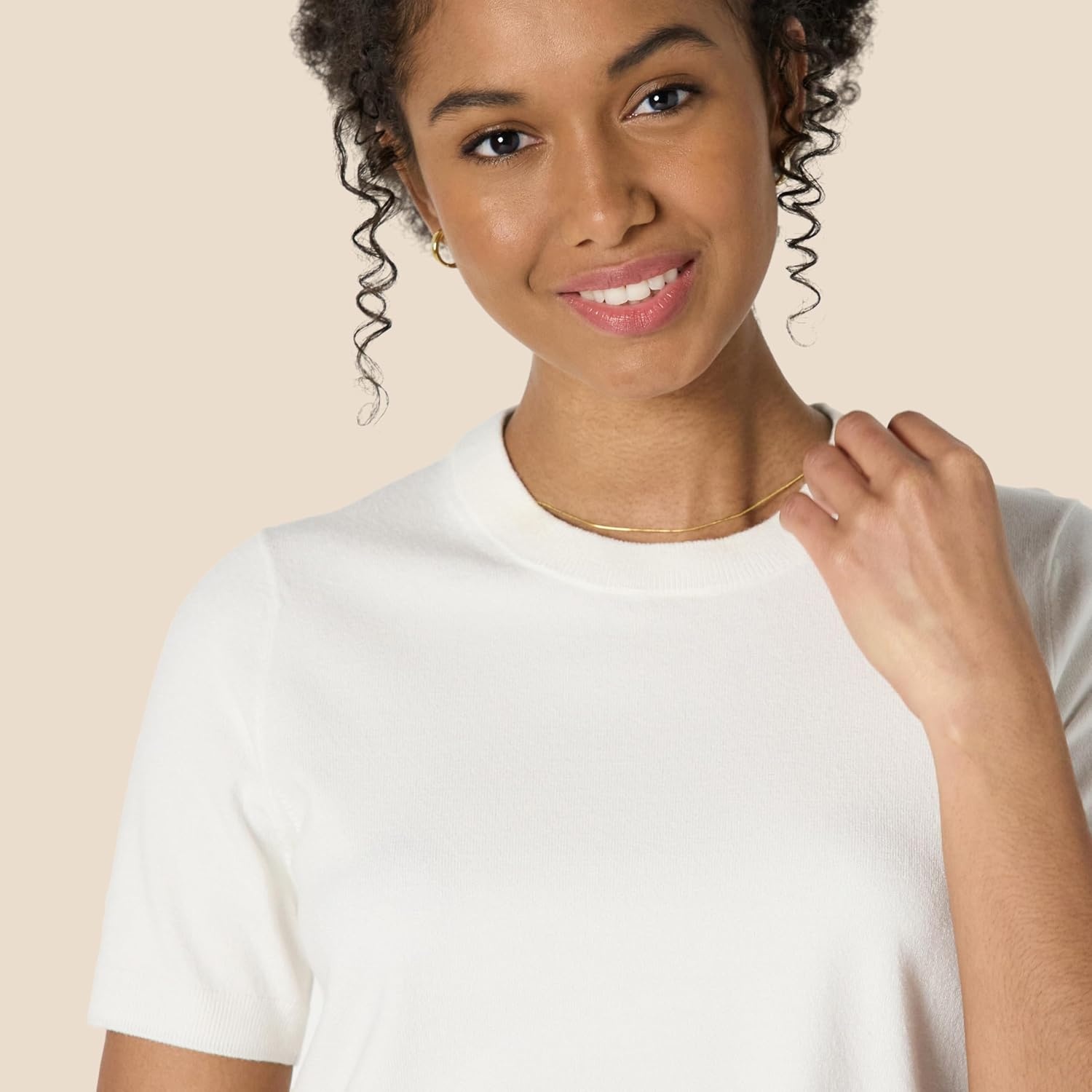 image:imageAmazon Essentials Womens RegularFit Cap Sleeve Mock Neck Sweater TopEggshell White