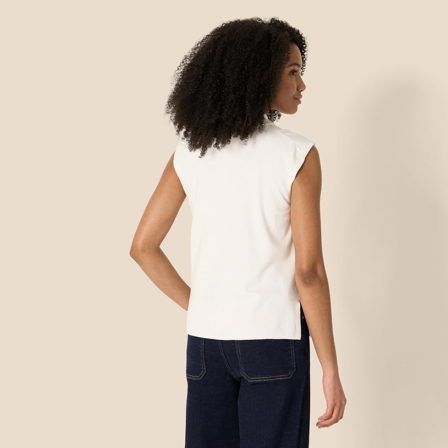 image:imageAmazon Essentials Womens RegularFit Cap Sleeve Mock Neck Sweater TopEggshell White