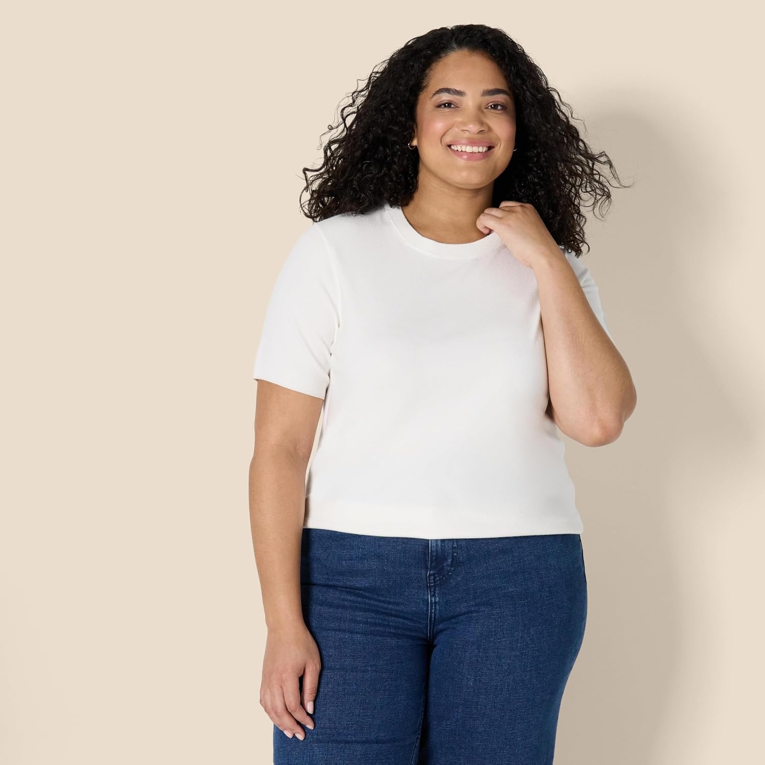 image:imageAmazon Essentials Womens RegularFit Cap Sleeve Mock Neck Sweater TopEggshell White