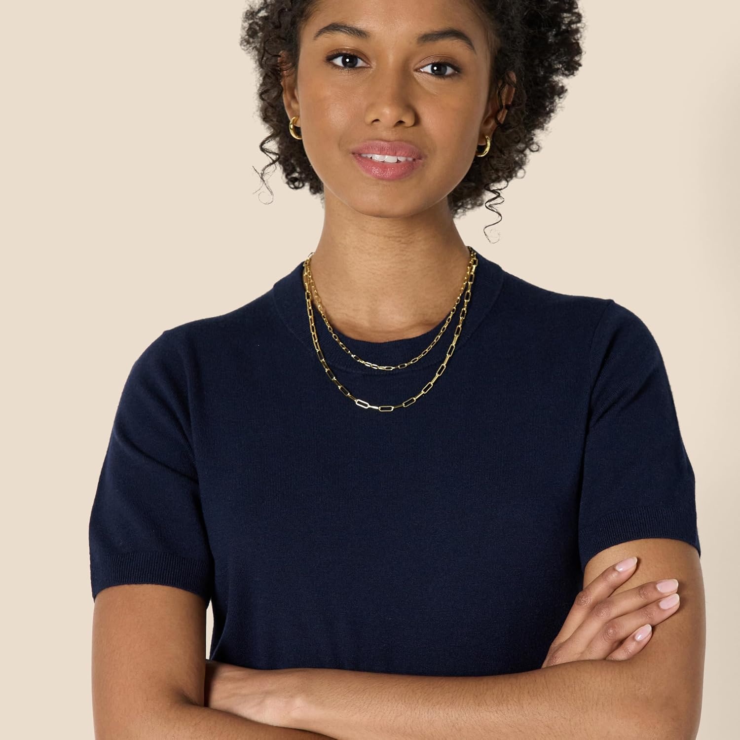 image:imageAmazon Essentials Womens RegularFit Cap Sleeve Mock Neck Sweater TopNavy