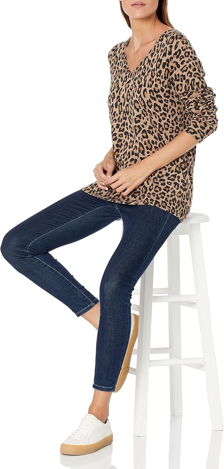 image:imageAmazon Essentials Womens RegularFit Lightweight LongSleeve VNeck Sweater Ribbed Cozy Soft Available in Plus SizeCamel Heather Animal Print