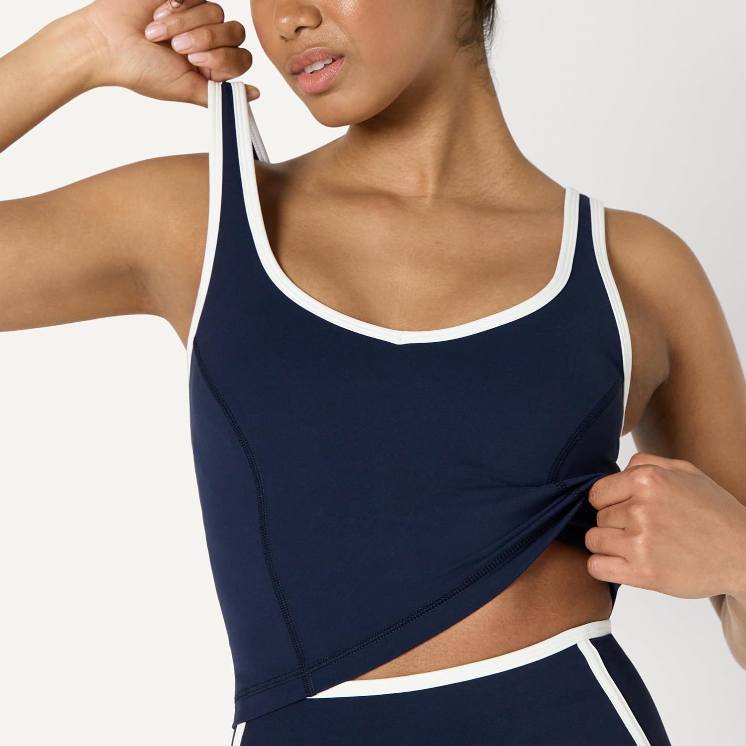 image:imageAmazon Essentials Womens Active FormFlex Buttery Soft Light Support Crop Tank with Bra Removable CupsNavyWhite
